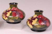 Lot 24 - A pair of Moorcroft Hibiscus pattern pottery...