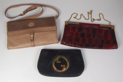 Lot 246 - A Gucci black suede flap bag, having a large...