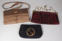 Lot 246 - A Gucci black suede flap bag, having a large...