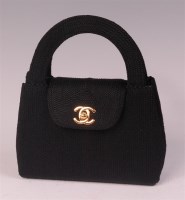 Lot 247 - A Chanel black embroidered small flap bag,...