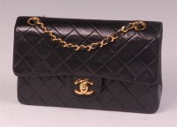 Lot 249 - A Chanel black lambskin leather small double...