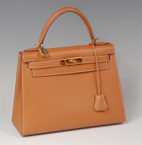 Lot 251 - A Hermés tan leather Kelly bag, with gilt...