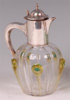 Lot 161 - An Art Nouveau silver and glass lidded claret...