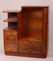 Lot 351 - An Art Deco figured walnut extensive dining...