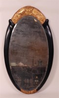 Lot 318 - An Art Deco period ebonised pine oval framed...