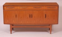 Lot 320 - A 1960s G Plan teak sideboard, having three...