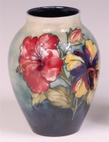 Lot 38 - A Moorcroft Clematis pattern pottery vase, of...