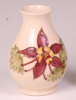 Lot 52 - A modern Moorcroft Magnolia pattern pottery...