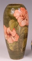 Lot 56 - A Moorcroft Hibiscus pattern pottery vase, of...