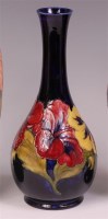 Lot 57 - A Moorcroft Anemone pattern pottery bottle...