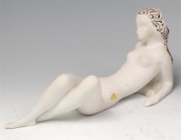 Lot 106 - A Royal Dux porcelain figure of a recumbent...