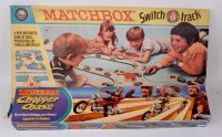 Lot 2324 - Three boxed matchbox play sets and track sets,...
