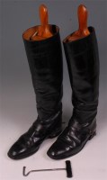 Lot 270 - A pair of black leather riding boots with...