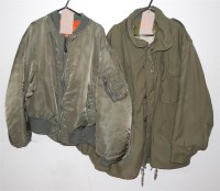 Lot 297 - An American army fatigue jacket, together with...