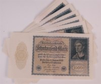 Lot 146 - A run of 15 German 10,000 mark, Reichbanknote...