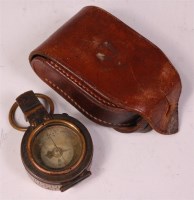 Lot 215 - A WW I brass cased prismatic compass, stamped...