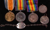 Lot 223 - A family group of three WW I medals to include...