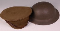Lot 236 - A post WW II peaked cap with leather strap,...
