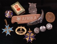 Lot 235 - A collection of various military badges to...
