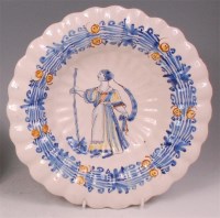 Lot 443 - An 18th century Dutch Delft lobed charger,...