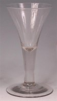 Lot 454 - An 18th century drawn trumpet wine glass, of...