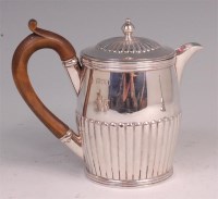Lot 467 - A late Victorian silver hot water pot, of half-...
