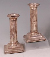 Lot 476 - A pair of Edwardian silver candlesticks,...