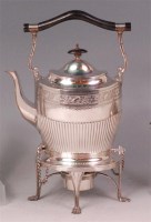 Lot 477 - A late Victorian silver plated spirit kettle...