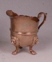 Lot 483 - A George V silver cream jug, of helmet form,...
