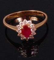 Lot 522 - A ladies yellow metal ruby and diamond cluster...