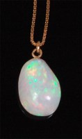 Lot 529 - A heavy polished opal pendant, on 18ct...