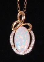 Lot 551 - A contemporary 14ct gold opal and diamond set...