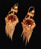 Lot 555 - A pair of circa 1900 pinchbeck and brown topaz...