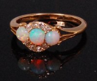 Lot 558 - A ladies 18ct gold opal and diamond cluster...