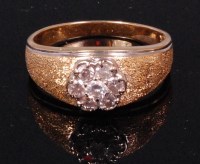 Lot 568 - A contemporary 14ct gold diamond cluster ring,...