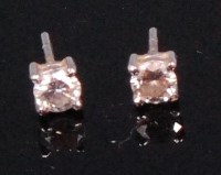 Lot 572 - A pair of 18ct white gold diamond ear studs,...