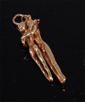 Lot 589 - A contemporary 9ct gold pendant 'The lovers',...