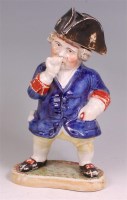 Lot 447 - A Victorian Staffordshire standing Toby taking...