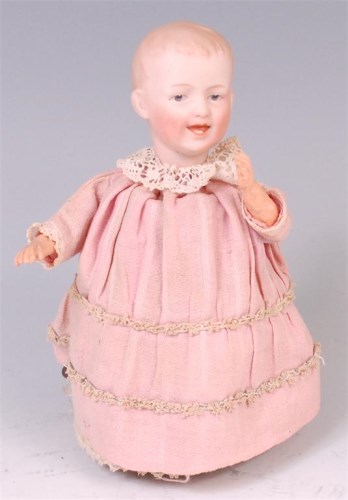 Lot 611 - A Heubach mechanical walking doll, having...