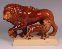 Lot 361 - A late 19th century treacle-glazed Lioness...