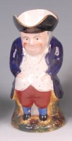 Lot 363 - A late Victorian Staffordshire Toby jug,...