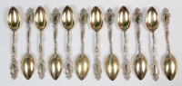 Lot 385 - A set of twelve continental silver gilt coffee...