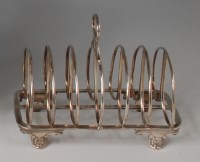Lot 419 - A George IV silver six division toast rack,...
