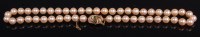 Lot 480 - A cultured pearl knotted single string choker,...