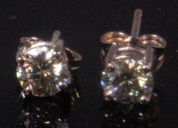 Lot 485 - A pair of 18ct white gold diamond solitaire...