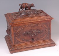 Lot 560 - A late 19th century Black Forest carved walnut...