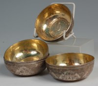 Lot 612 - A set of four Persian silver finger bowls,...