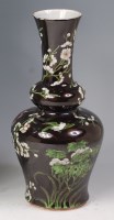 Lot 654 - A Chinese stoneware double gourd vase, enamel...