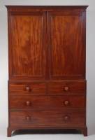 Lot 808 - An early 19th century mahogany linen press,...