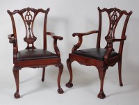 Lot 825 - A set of twelve Chippendale style carved...